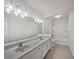 Bathroom with double sinks, white cabinets and a shower/tub combination at 9174 Retreat Pass, Jonesboro, GA 30236
