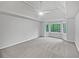Large primary bedroom features a vaulted ceiling, a ceiling fan, neutral walls, and a bay window at 9174 Retreat Pass, Jonesboro, GA 30236