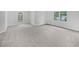 Bright bedroom features fresh neutral paint, new plush carpet, and large windows overlooking the yard at 9174 Retreat Pass, Jonesboro, GA 30236
