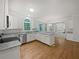 Modern kitchen with stainless appliances, hardwood floors, and granite countertops at 9174 Retreat Pass, Jonesboro, GA 30236