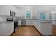 A newly remodeled kitchen with stainless steel appliances, granite countertops and hardwood flooring at 9174 Retreat Pass, Jonesboro, GA 30236