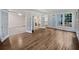 Open-concept living area with French doors, hardwood floors and bright light at 9174 Retreat Pass, Jonesboro, GA 30236
