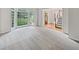 Cozy living room boasts large bay windows, neutral carpet, and stairway access at 9174 Retreat Pass, Jonesboro, GA 30236