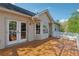 Back deck featuring access to home through french doors and white banister railing at 2099 Winsburg Nw Way, Kennesaw, GA 30144
