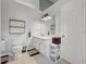 Bright bathroom with ample lighting, white cabinetry, and decorative shelving at 2099 Winsburg Nw Way, Kennesaw, GA 30144