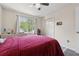 Charming bedroom offers hardwood floors, a ceiling fan, and natural light at 2099 Winsburg Nw Way, Kennesaw, GA 30144