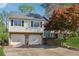 Split level home features two-car garage and beautifully landscaped yard at 2099 Winsburg Nw Way, Kennesaw, GA 30144