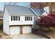 Charming exterior with a two-car garage and lush landscaping at 2099 Winsburg Nw Way, Kennesaw, GA 30144