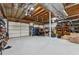 Unfinished garage with door, shelving, and visible rafters at 2099 Winsburg Nw Way, Kennesaw, GA 30144