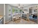 Open eat-in kitchen area features a large island, stainless steel appliances, and views of the backyard at 2099 Winsburg Nw Way, Kennesaw, GA 30144