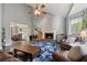 Spacious living room with high ceilings, a fireplace, and an adjacent dining area at 2099 Winsburg Nw Way, Kennesaw, GA 30144