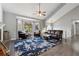 Open living room with hardwood floors, vaulted ceiling, and bay window with natural light at 2099 Winsburg Nw Way, Kennesaw, GA 30144