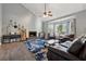 Bright living room featuring a cozy fireplace, vaulted ceiling, and a bay window at 2099 Winsburg Nw Way, Kennesaw, GA 30144