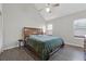 Vaulted bedroom offers neutral walls, wood flooring, and a ceiling fan at 2099 Winsburg Nw Way, Kennesaw, GA 30144