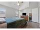 Bright, spacious main bedroom offers vaulted ceiling, wood floors, and a ceiling fan at 2099 Winsburg Nw Way, Kennesaw, GA 30144