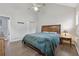 Spacious bedroom features neutral walls, wood flooring, and a ceiling fan at 2099 Winsburg Nw Way, Kennesaw, GA 30144