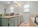 Spacious bathroom with large vanity and cabinets, tile floors, and a soaking tub at 2645 Sandstone Dr, Lawrenceville, GA 30043