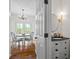 Cozy half bathroom and dining area in the background with hardwood floors and great lighting at 2645 Sandstone Dr, Lawrenceville, GA 30043