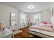 Bright bedroom featuring hardwood floors, natural light, double windows and neutral décor at 2645 Sandstone Dr, Lawrenceville, GA 30043