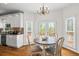 Bright dining area with white cabinets, stainless appliances and access to the deck at 2645 Sandstone Dr, Lawrenceville, GA 30043