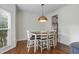 Bright dining area with hardwood floors, pendant lighting and a view to the Kitchen at 2645 Sandstone Dr, Lawrenceville, GA 30043