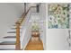 Welcoming foyer with hardwood floors, stairs leading to the second floor, and a dining area view at 2645 Sandstone Dr, Lawrenceville, GA 30043