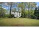 Charming two-story home with manicured lawn and mature trees, providing a welcoming curb appeal at 2645 Sandstone Dr, Lawrenceville, GA 30043