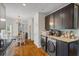 Modern kitchen area with stainless appliances and black cabinets and an eat-in dining area at 2645 Sandstone Dr, Lawrenceville, GA 30043