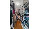 Walk-in closet features wood floors, great storage with built in shelving and lots of space at 2645 Sandstone Dr, Lawrenceville, GA 30043