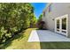 View of the backyard with a concrete patio, landscaping, and privacy fence at 3705 Paces Park Se Cir, Smyrna, GA 30080