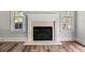 Elegant fireplace with a decorative mantle and hearth, flanked by windows at 3705 Paces Park Se Cir, Smyrna, GA 30080