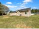 The back of a one-story house showing the exterior, the AC unit, and a level yard at 41 Olde Town Way, Rockmart, GA 30153