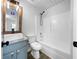 Bright bathroom with a modern vanity, a vessel sink, and a shower-tub combo, offering a clean, updated space at 41 Olde Town Way, Rockmart, GA 30153