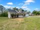 Charming one-story house featuring dormer windows, a two-car garage, a covered porch, and a spacious front yard at 41 Olde Town Way, Rockmart, GA 30153