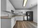 Efficient kitchen with white cabinets, stainless steel appliances, and hardwood floors for a clean, modern look at 41 Olde Town Way, Rockmart, GA 30153