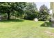 Spacious backyard showcasing green lawn and mature trees at 4424 Robinson St, Acworth, GA 30101