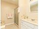 Cozy bathroom featuring a tiled shower with glass door, a vanity sink, and neutral decor at 4424 Robinson St, Acworth, GA 30101