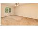 Bright bedroom with a large window offering natural light and a ceiling fan for comfort at 4424 Robinson St, Acworth, GA 30101
