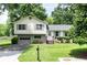 Charming two-story home with a well-maintained lawn and mature trees at 4424 Robinson St, Acworth, GA 30101
