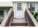 Inviting entrance with a wooden porch, a stylish white front door, and decorative wreath at 4424 Robinson St, Acworth, GA 30101