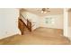 Carpeted Living room with a staircase and a ceiling fan providing a comfortable atmosphere at 4424 Robinson St, Acworth, GA 30101