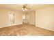 Large primary bedroom featuring a ceiling fan and access to en-suite bathroom and walk-in closet at 4424 Robinson St, Acworth, GA 30101