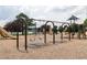 Community playground with swings, slides, and climbing structures on a wood chip safety surface, perfect for outdoor fun at 4424 Robinson St, Acworth, GA 30101