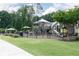 A fenced playground with a variety of equipment, offering a safe and fun environment at 4424 Robinson St, Acworth, GA 30101