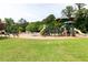 Community playground featuring slides, climbing structures, and ample green space for outdoor recreation and Gathering fun at 4424 Robinson St, Acworth, GA 30101