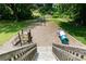 Playground featuring slides, tunnels, and climbing equipment with a wood chip ground cover at 4424 Robinson St, Acworth, GA 30101