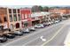 Charming street with a row of stores and parked cars, showcasing the vibrant atmosphere of downtown at 4424 Robinson St, Acworth, GA 30101