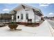 Quaint train depot with a white exterior, black accents, and well-maintained landscaping, reflecting local architecture at 4424 Robinson St, Acworth, GA 30101