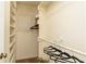 Organized walk-in closet with built-in shelving and hanging rods at 4424 Robinson St, Acworth, GA 30101