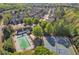 Aerial view of a community featuring a pool, tennis courts and mature trees at 265 Valley Xing, Canton, GA 30114